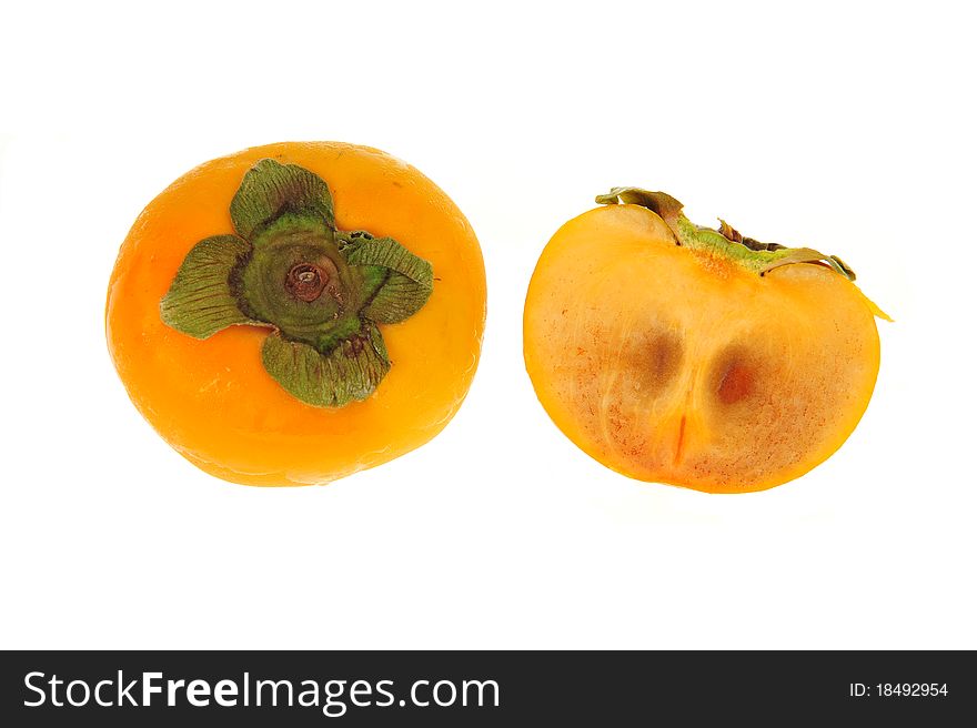 Persimmon And A Sliced Section Showing the Seeds Within. Fruit Is Isolated on White Background