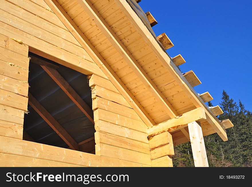 Building of the wooden house on a bright photo. Building of the wooden house on a bright photo