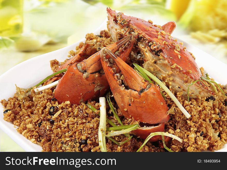 An Chinese fried crab on white dish