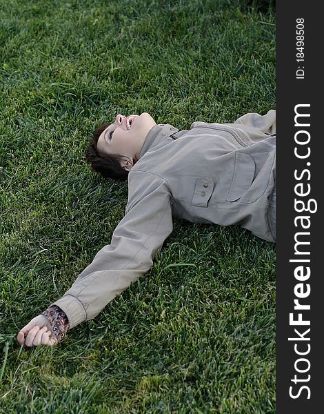 Girl lying on green grass. Girl lying on green grass