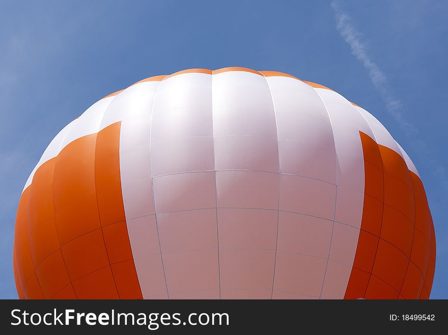 Top of a hot air balloon isolated on blue. Top of a hot air balloon isolated on blue