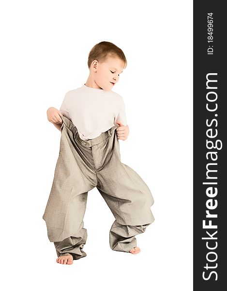 This photograph shows a boy in father's trousers