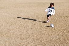 Football Chasing Boy Stock Photography Football Chasing Boy Stock Photography