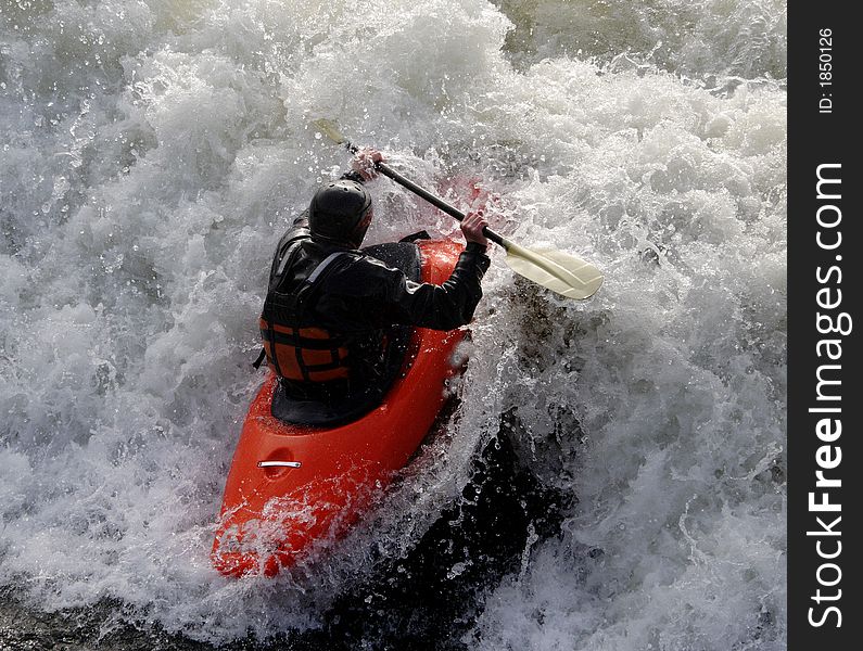 Man paddling his Kayak on White Water Rapids. Man paddling his Kayak on White Water Rapids