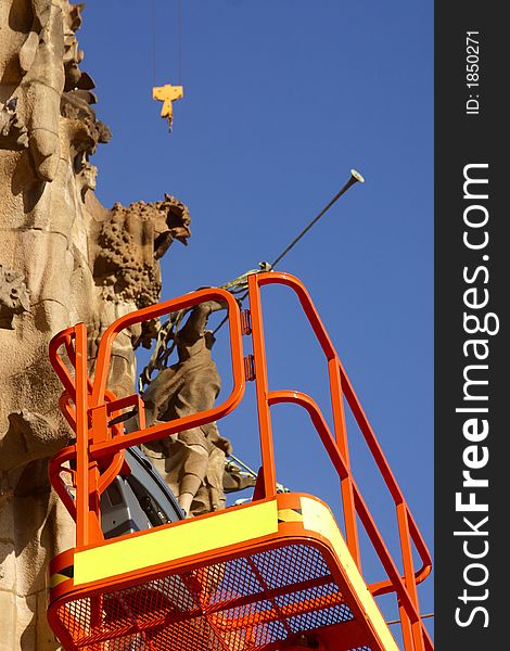 Detail of the crane working at  the towers of la Sagrada Familia at the city of Barcelona, Catalunya, Spain, Europe. Detail of the crane working at  the towers of la Sagrada Familia at the city of Barcelona, Catalunya, Spain, Europe