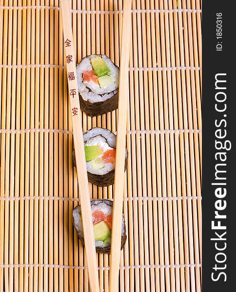 Picture of sushi and wooden chopsticks