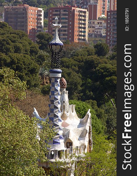 Towers of the Parc Guell with buildings behind at the city of Barcelona, Catalunya, Spain, Europe