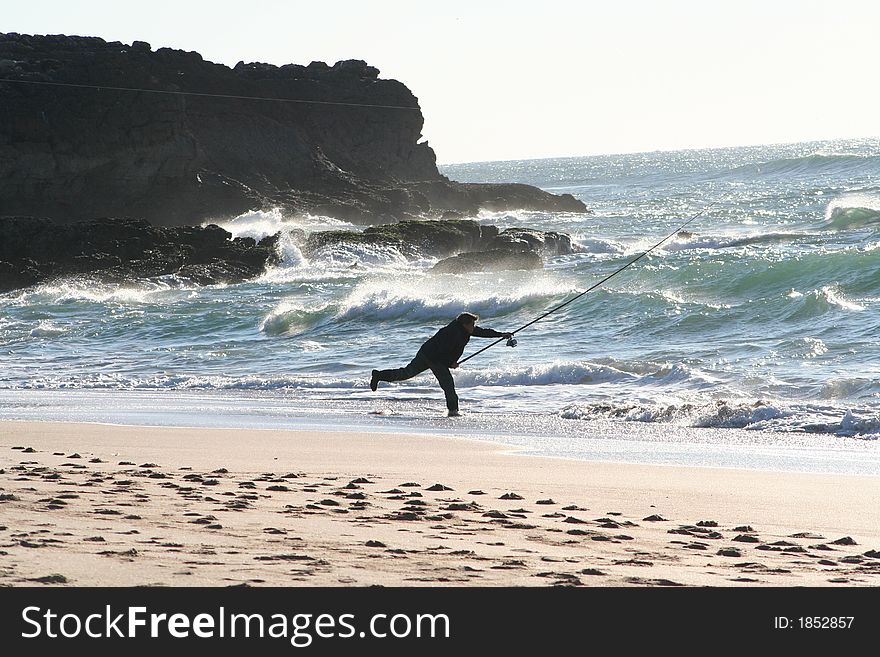 Fisherman throwing the hook to catch some fish