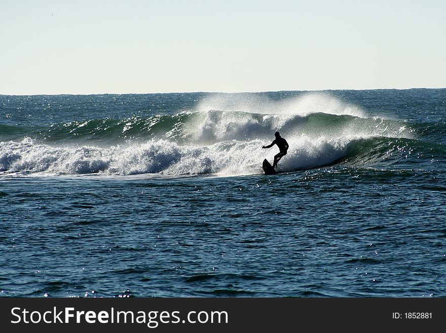 Surfer dropping a tube wave