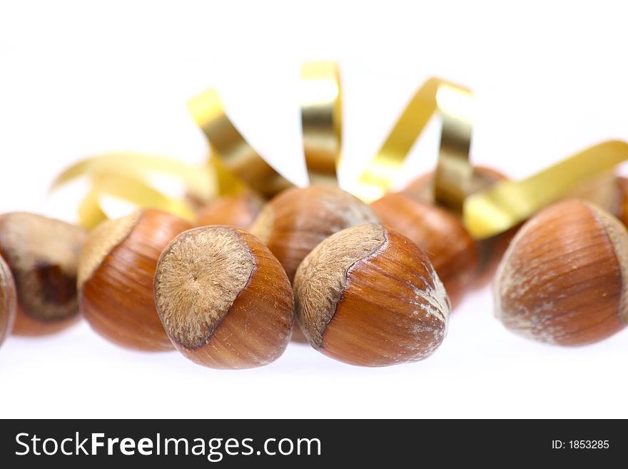 Closeup for little hazelnuts isolated on white background