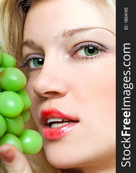 Beautiful Young Woman With Green Grape