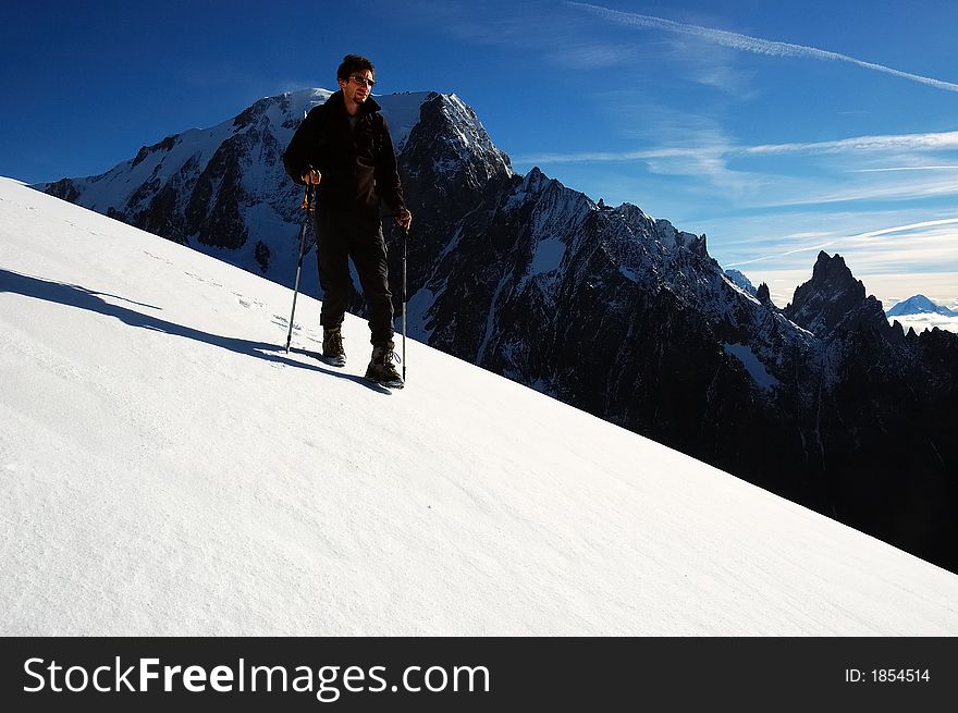 Trekker in front of the west face of Mont Blanc, Italy. Trekker in front of the west face of Mont Blanc, Italy.