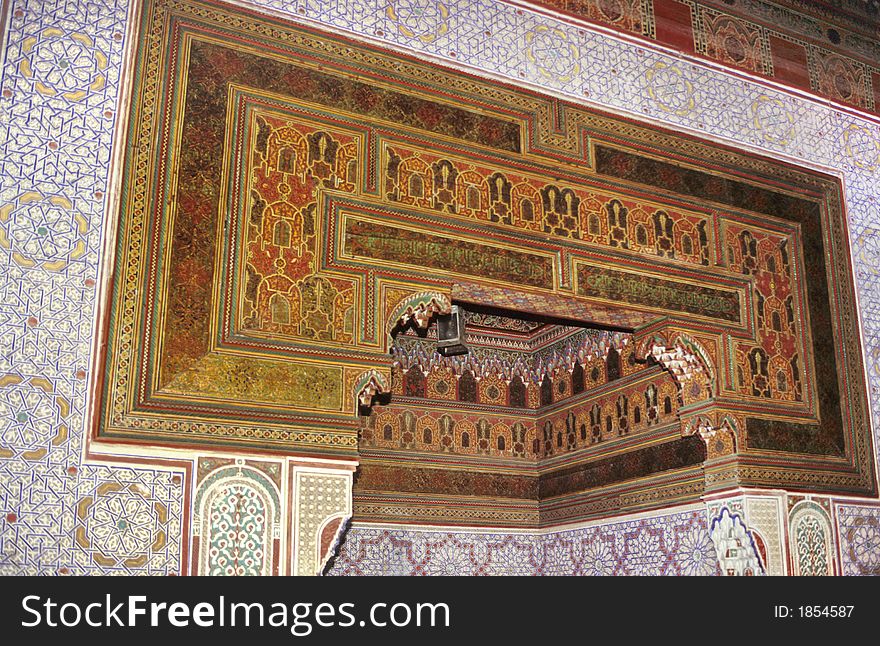 Fully decorated wall and ceiling with typical arabic design of an antique moroccan rich palace in Marrakesh. Fully decorated wall and ceiling with typical arabic design of an antique moroccan rich palace in Marrakesh