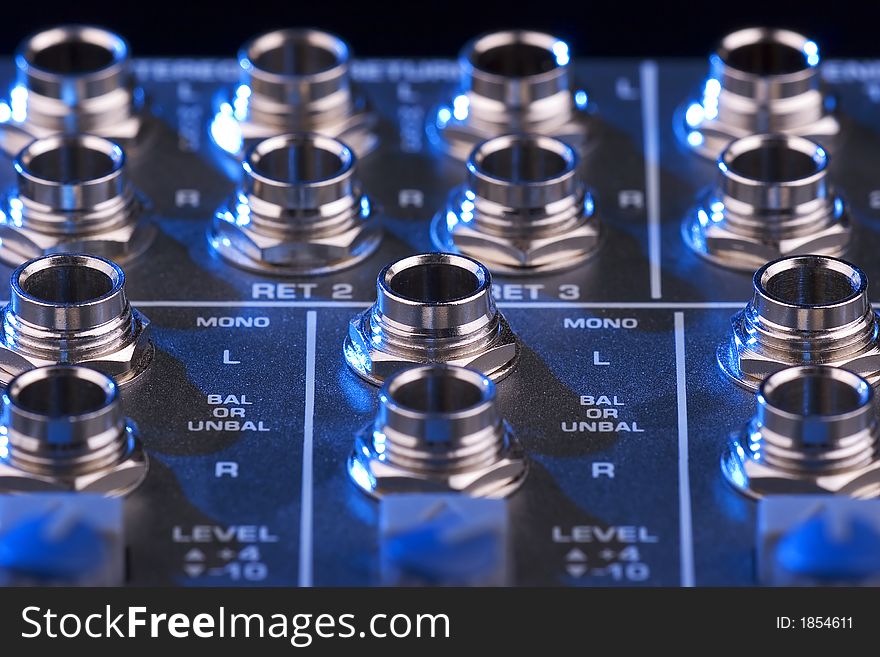 Close-up photo of a sound mixing board. Close-up photo of a sound mixing board