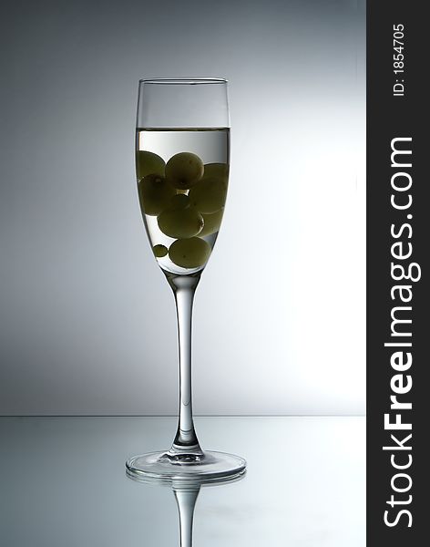 Grapes in the glass of liquid