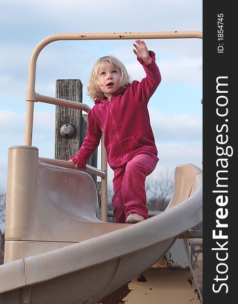 Toddler Playing on Slide