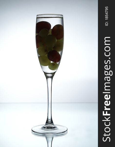 Grapes in the glass of liquid