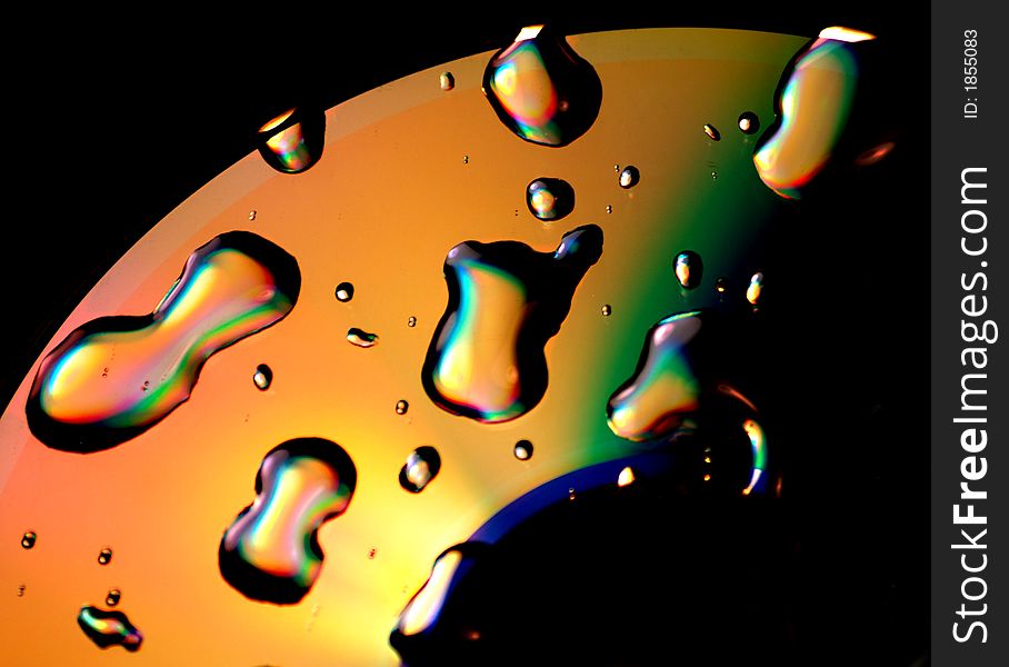 A photo of water droplets on a dvd