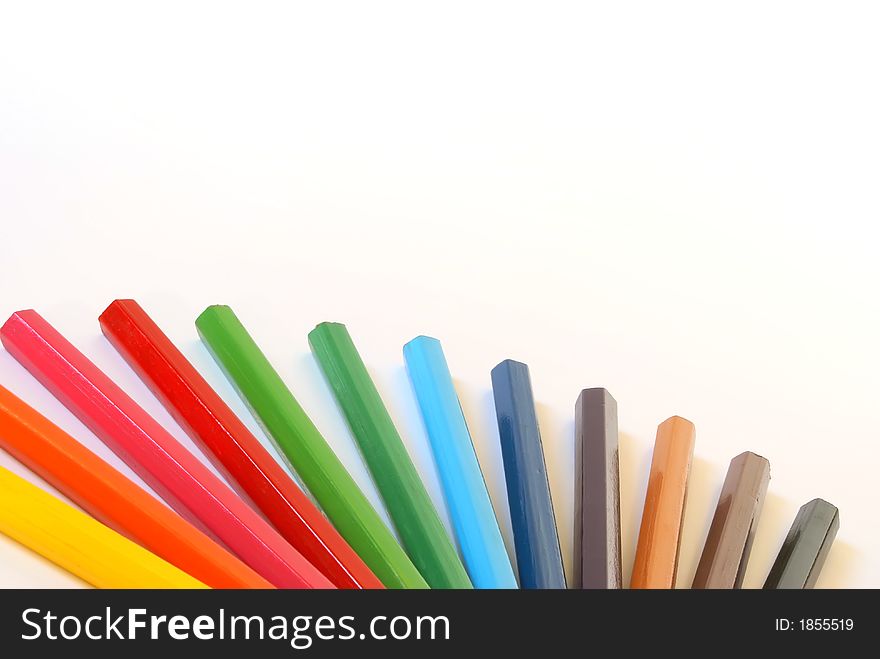 Wooden colour pencils close-up composition. Isolated over white. Wooden colour pencils close-up composition. Isolated over white.