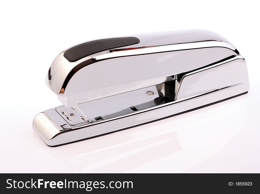 A high quality silver office stapler isolated on a white background. A high quality silver office stapler isolated on a white background