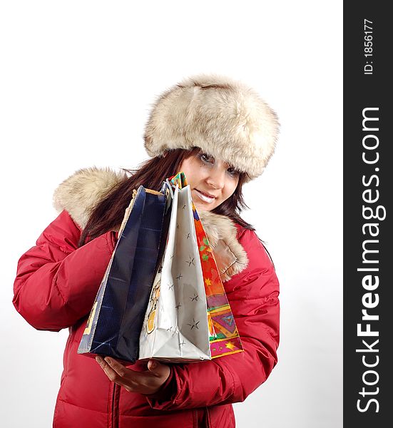 Attractive woman with shopping bags on white background. Attractive woman with shopping bags on white background