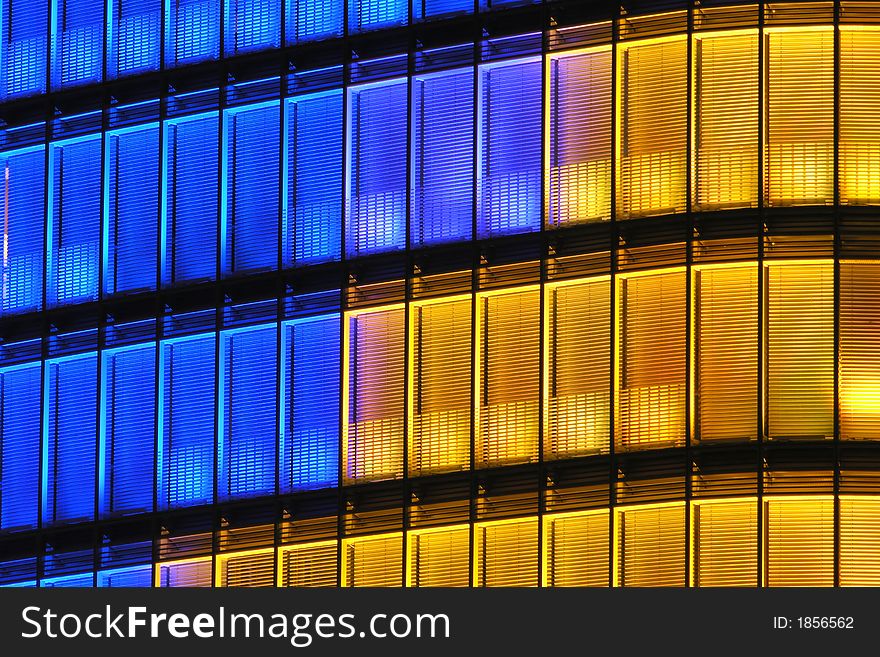 Modern office building with lights at night. Modern office building with lights at night