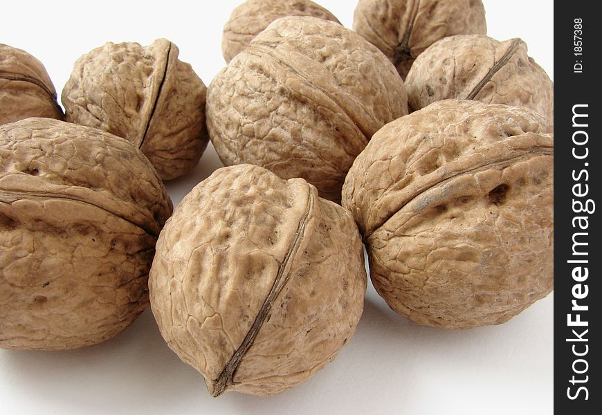 Some walnuts on the light background