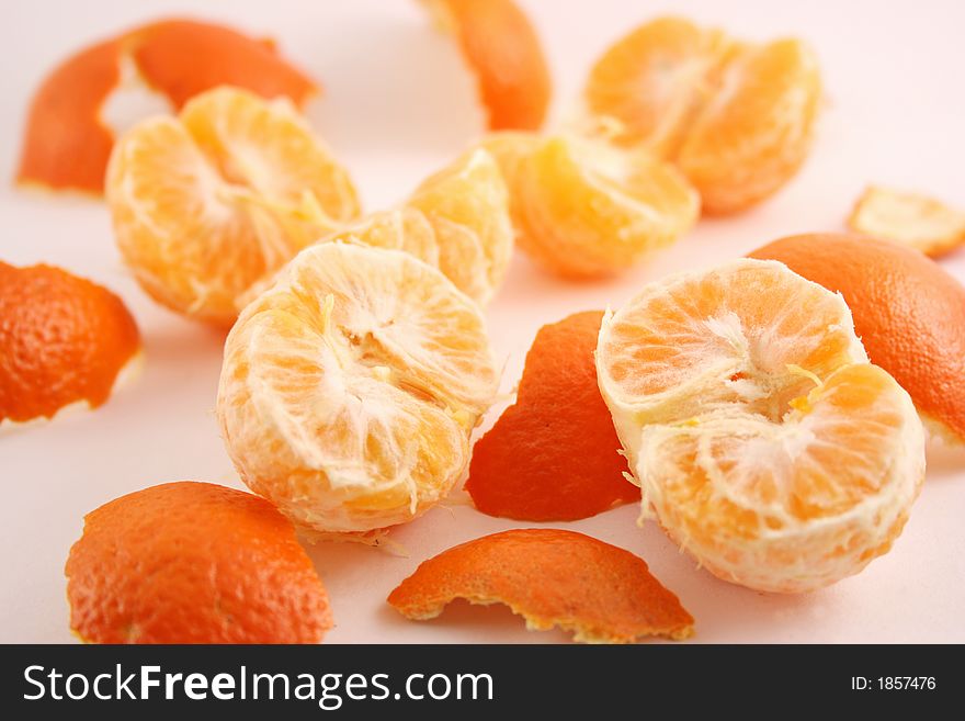 Peeled mandarin isolated on white background