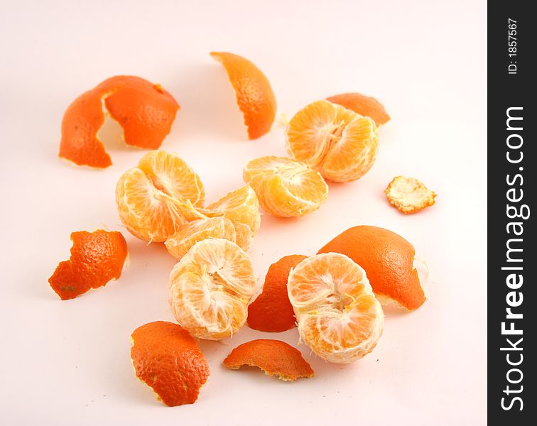 Peeled mandarins on a white background