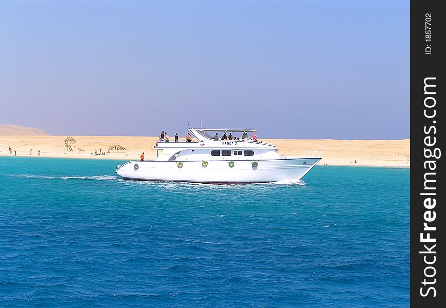 Bright wight yacht is sailing on the Red Sea with tourist's group. Bright wight yacht is sailing on the Red Sea with tourist's group