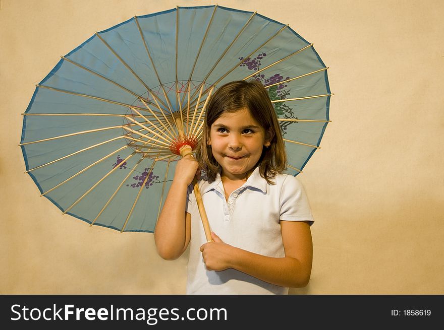 Girl holding a blue parasol/umbrella. Girl holding a blue parasol/umbrella