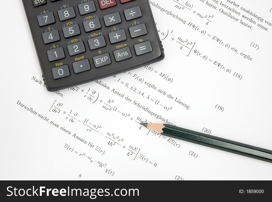 Still life of an calculator and a pencil on scientific paper. Still life of an calculator and a pencil on scientific paper