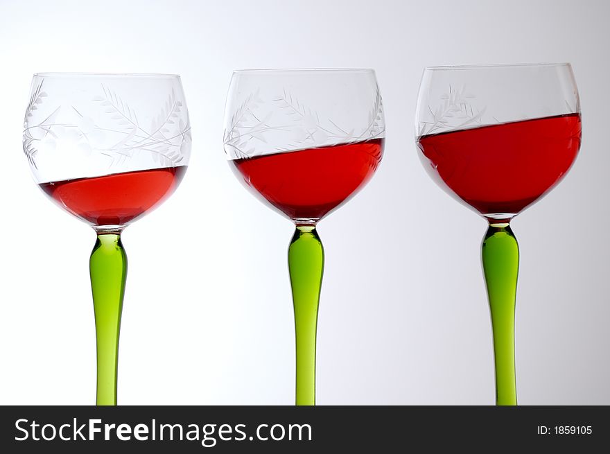 Three glasses with wine and gravity effect. Three glasses with wine and gravity effect