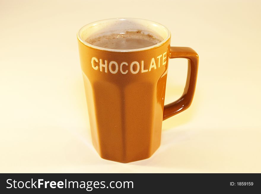 Cup hot chocolate milk with light background