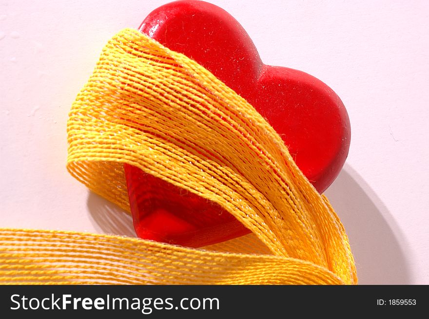 Red heart with yellow ribbon. Red heart with yellow ribbon