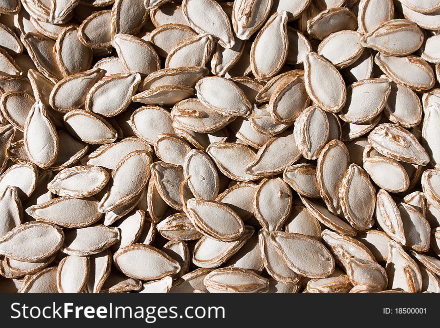 Real raw pumpkin seeds background