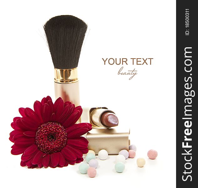 Isolated cosmetics accesories with red flower. Isolated cosmetics accesories with red flower