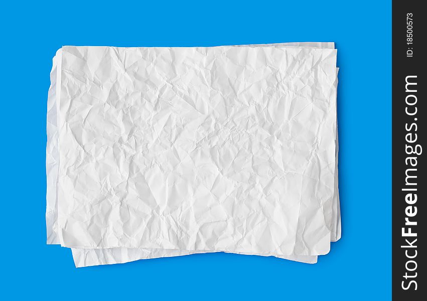 Crumpled paper stack isolated on blue background