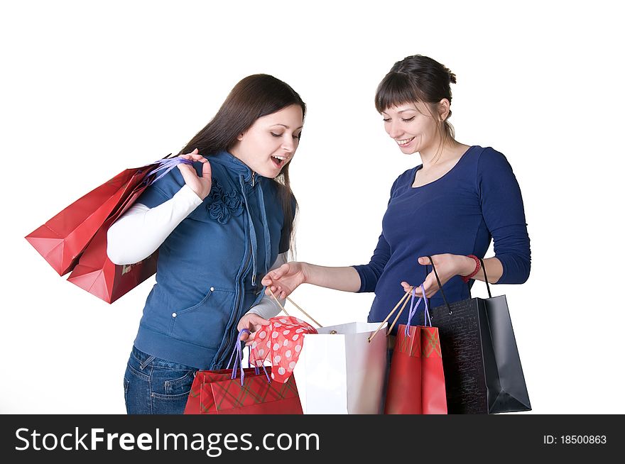 Two happy girls with shopping bags. Two happy girls with shopping bags