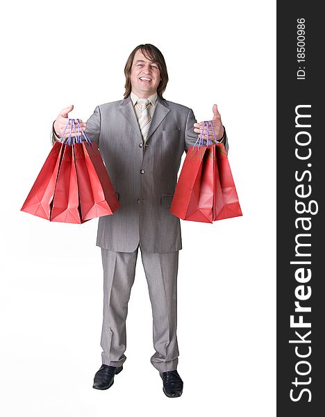 A man who smiles, holding shopping bags