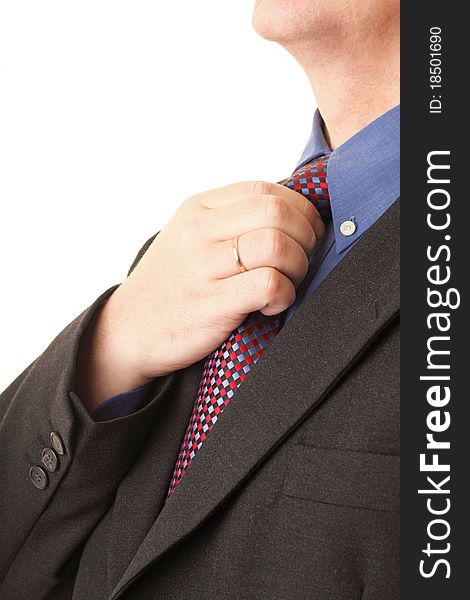 Businessman adjusting his tie blue