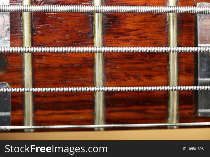 Wooden electrical bass guitar background