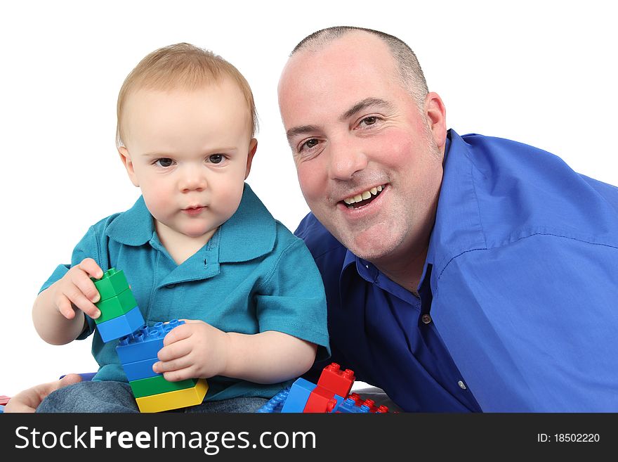 Father and son building with colorful blocks. Father and son building with colorful blocks