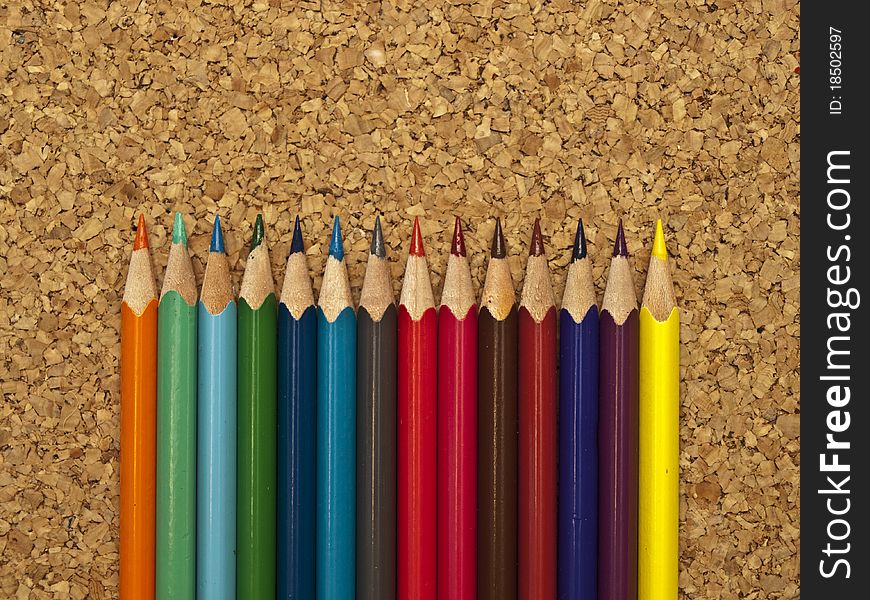 Colored pencils on a folder. Colored pencils.
