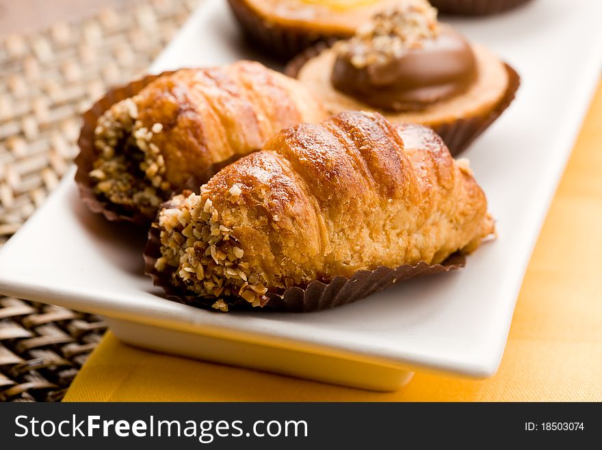 Photo of different delicious pastries on the table