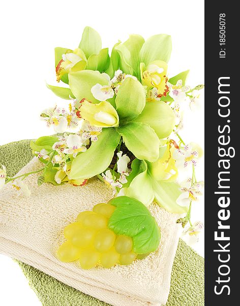 Natural green  grape soap and orchid flower isolated on white background. Natural green  grape soap and orchid flower isolated on white background.