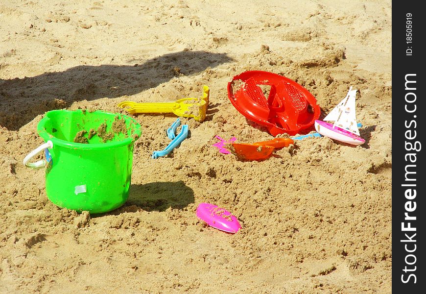 Colorful toys on the beach. Colorful toys on the beach.