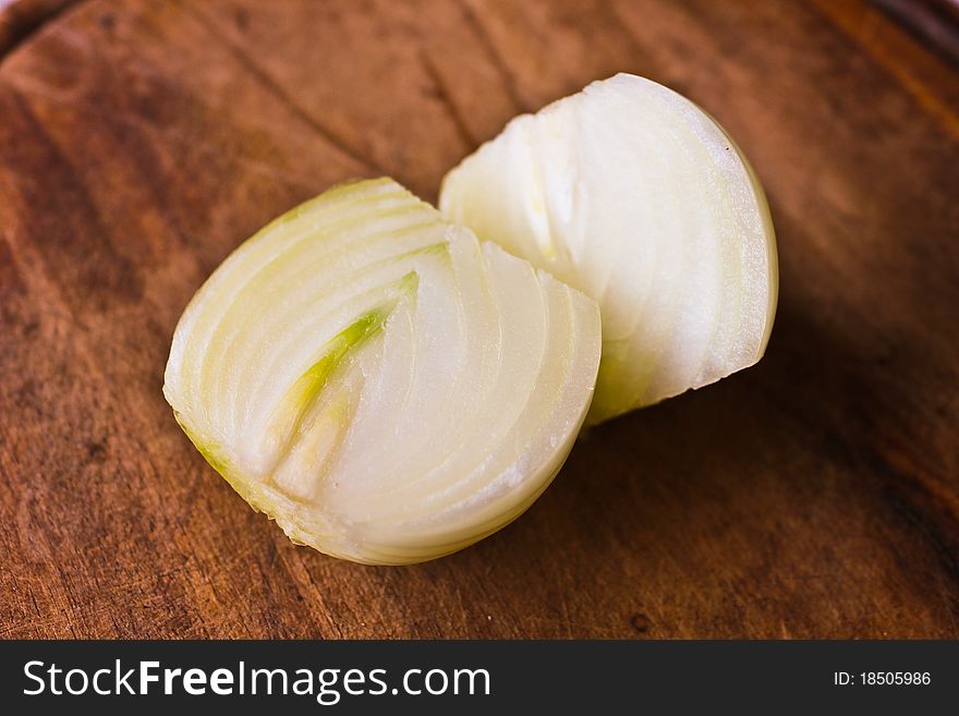 Cut onion on a wooden board