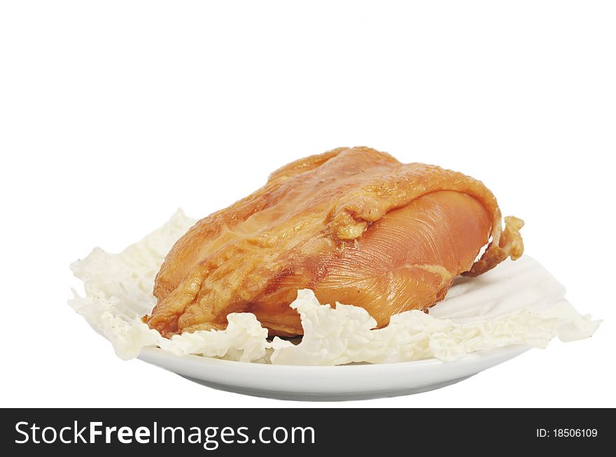 Smoked chicken in a dish on a white background