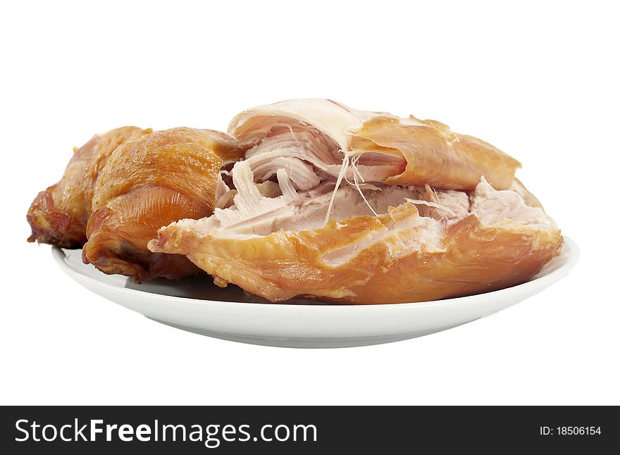 Smoked chicken in a dish on a white background